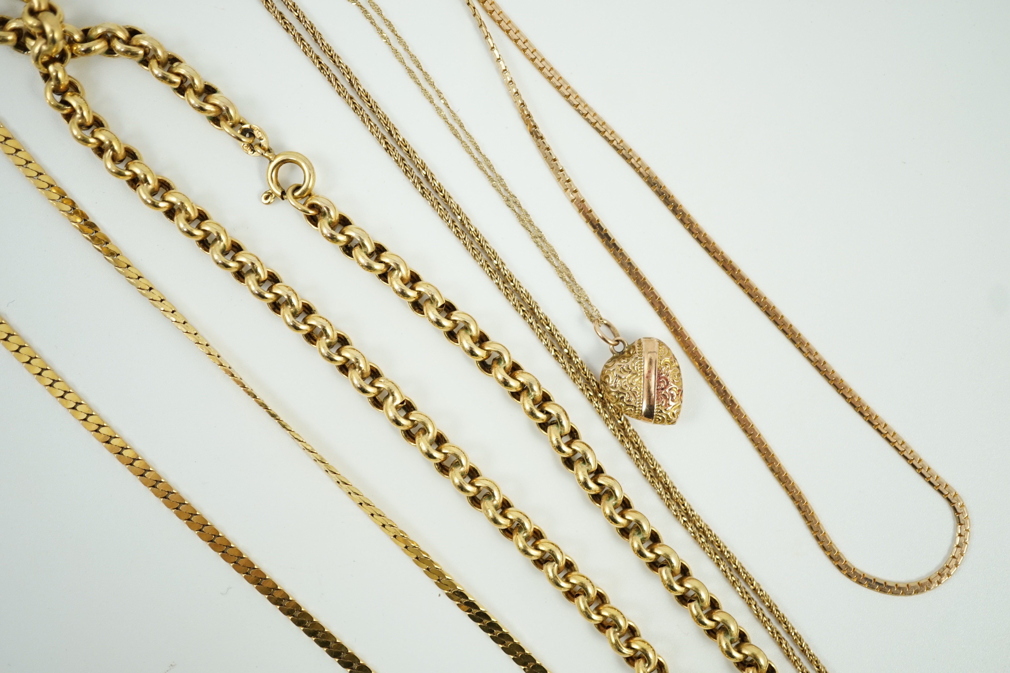 A 9ct heart shaped pendant, 12mm, in a 9ct chain and four other assorted modern 9ct chains, 32.8 grams.